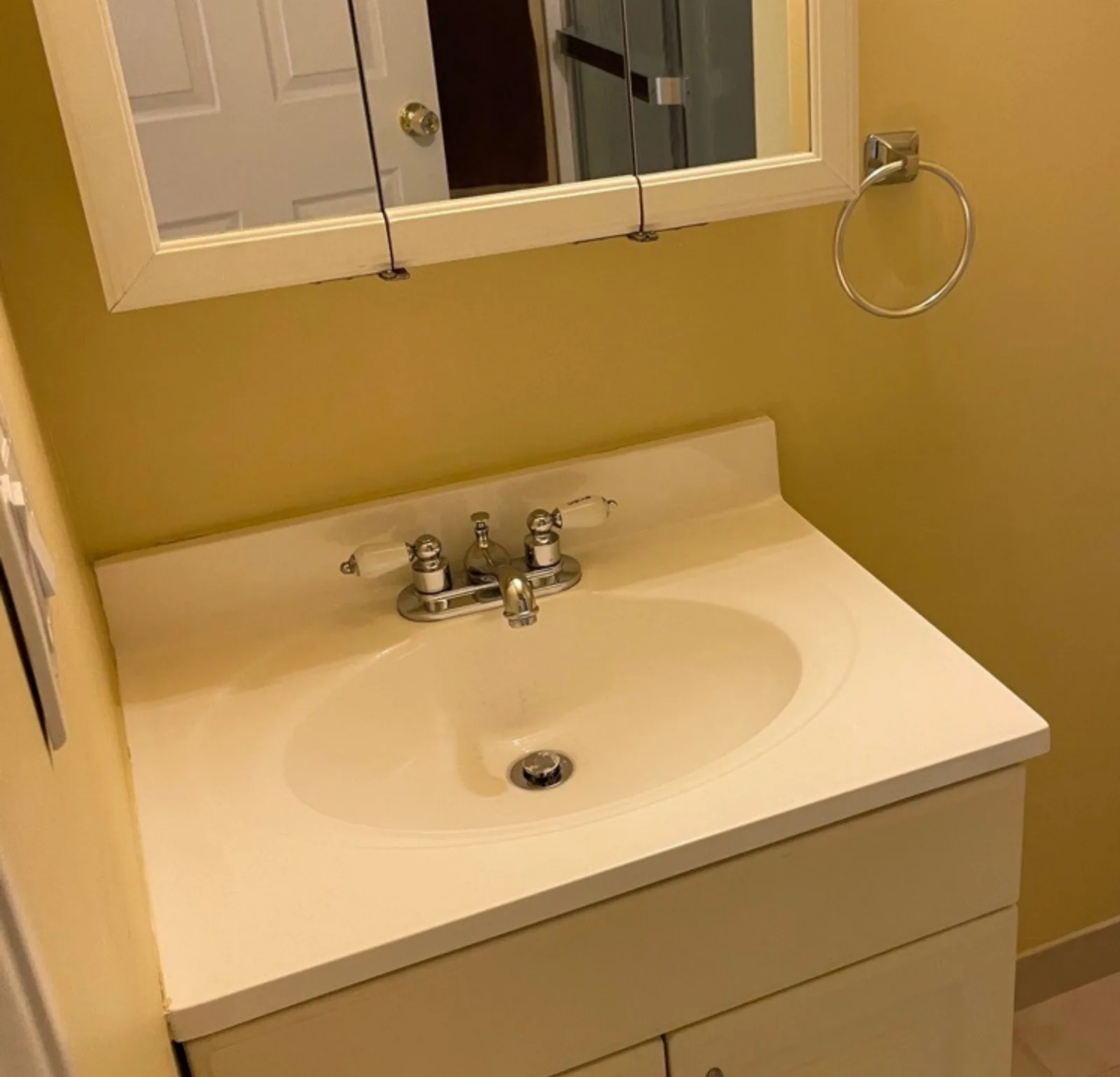 bathroom vanity mirror — cleaned by Verde Luxe Cleaning