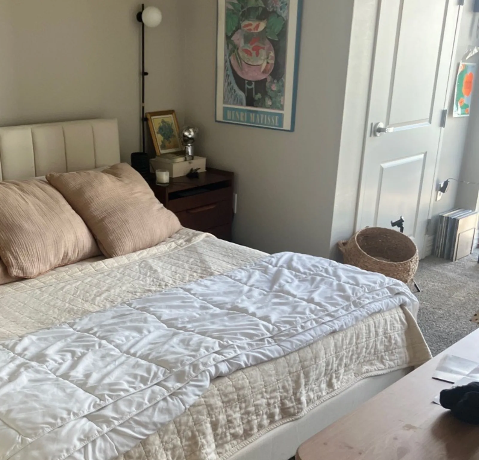 Made-up bedroom with upholstered headboard and fresh linens — Verde Luxe Cleaning