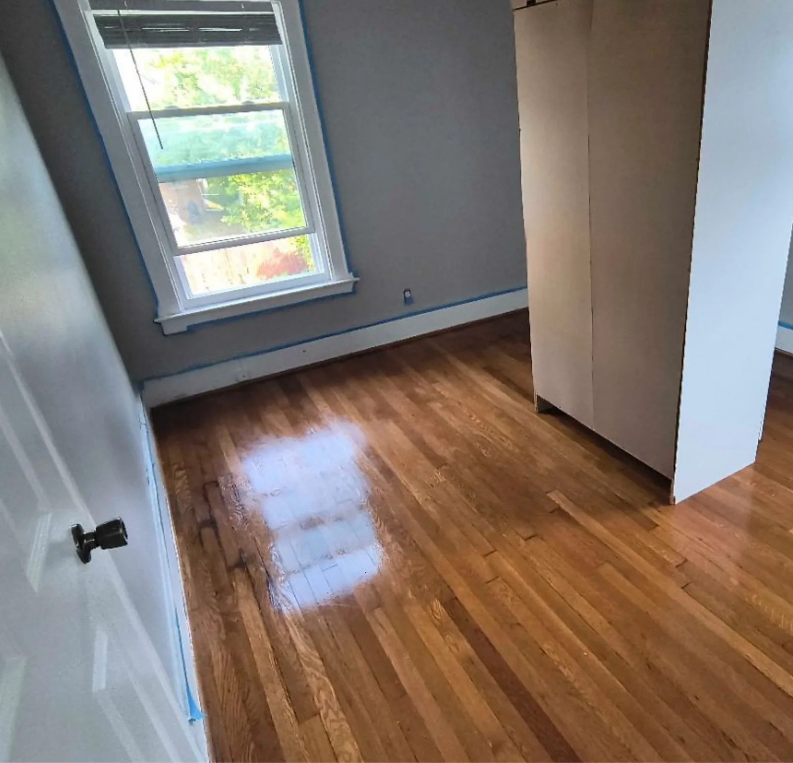 empty room hardwood door — cleaned by Verde Luxe Cleaning