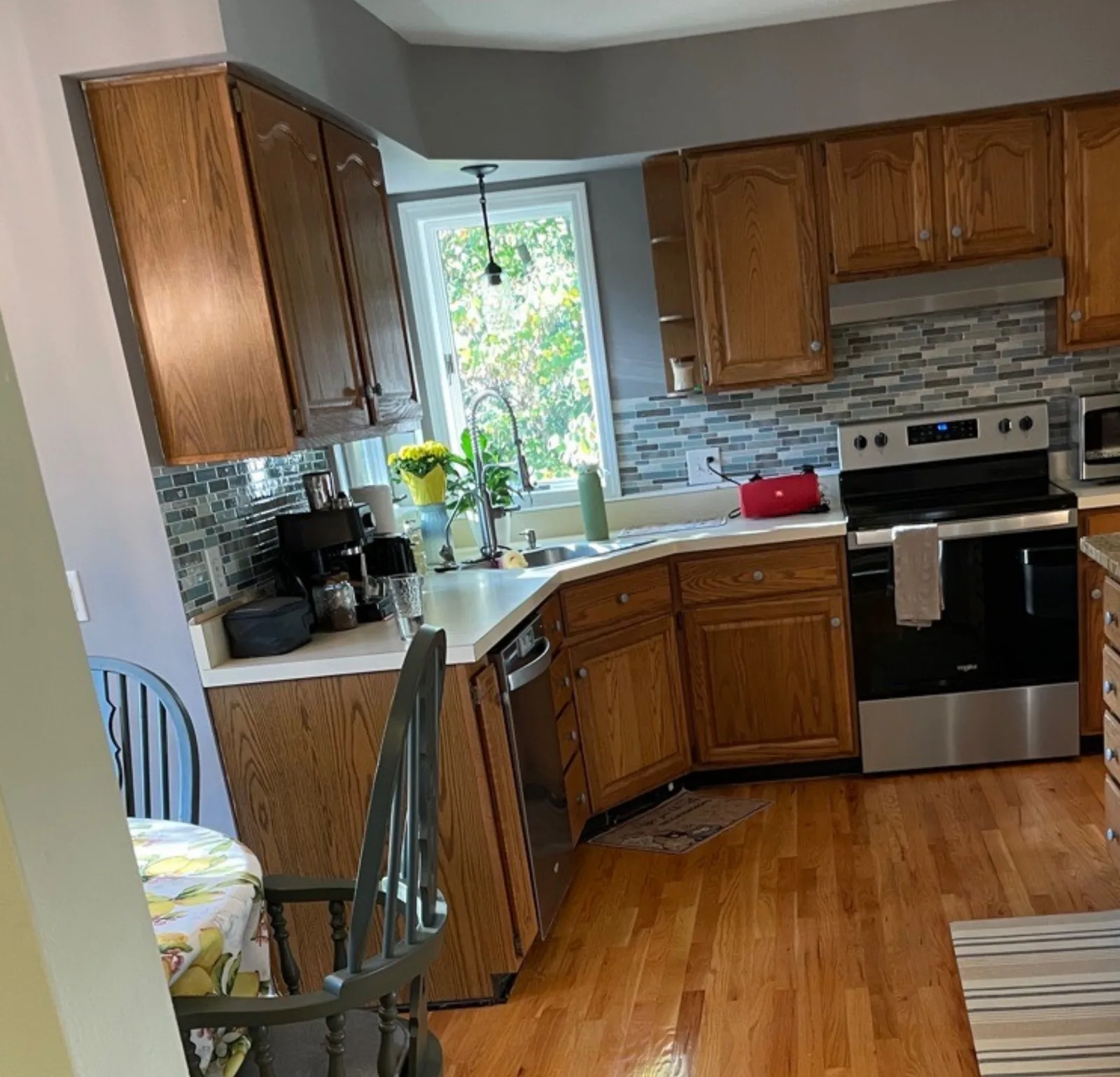 kitchen oak cabinets — cleaned by Verde Luxe Cleaning